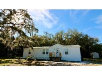 Charming single-story home with a well-maintained exterior and inviting front porch at 9161 Codel Loop, New Port Richey, FL 34654