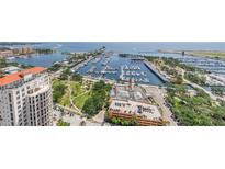 Stunning aerial view of a waterfront property with marina, city skyline, and lush landscaping at 100 1St N Ave # 3104, St Petersburg, FL 33701