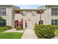 Charming condominium exterior with inviting landscaped entrance and classic architectural details at 13602 Frigate Ct # N201, Clearwater, FL 33762