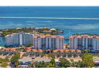 Breathtaking aerial view of the beachfront condo community with stunning ocean views and lush landscaping at 1325 Snell Isle Ne Blvd # 911, St Petersburg, FL 33704