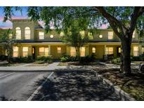 Charming townhome exterior with manicured landscaping and convenient parking at 256 Castlekeeper Pl, Valrico, FL 33594