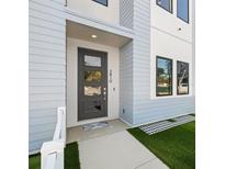 Modern home featuring a stylish front door and manicured landscaping at 2810 N Florida Ave, Tampa, FL 33602
