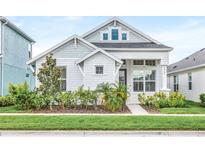 Charming one-story home showcasing a landscaped front yard and welcoming entrance at 28680 Cozy Creek Dr, Wesley Chapel, FL 33543
