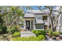 Charming townhouse with well-maintained landscaping and inviting front entry at 11450 Harbor Way # 5008, Largo, FL 33774