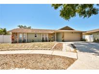 Charming single-story home featuring stone accents, a two-car garage, and a well-maintained lawn at 12532 115Th St, Largo, FL 33778