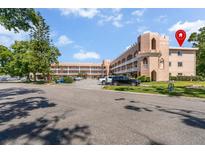 Charming condo building featuring unique architectural details and well-maintained landscaping at 2458 Columbia Dr E # 84, Clearwater, FL 33763