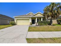 Charming single-Gathering home with manicured lawn, paved driveway, and welcoming curb appeal at 3015 Azalea Blossom Dr, Plant City, FL 33567