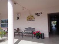 Inviting building entrance with comfortable seating, potted plants, and clear signage to welcome residents and guests at 5955 30Th S Ave # 108, Gulfport, FL 33707