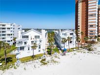Beautiful white beach condos with palm trees and access to white sands at 17960 Gulf Blvd # 111, Redington Shores, FL 33708
