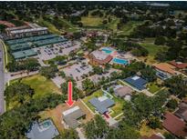 An aerial view of the home highlighting the proximity to golf, tennis, and a pool in a vibrant, active community at 2700 Westchester N Dr, Clearwater, FL 33761