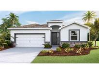 Charming single-story home with a two-car garage, stone accents, and well-maintained landscaping at 3320 Amber Waves Dr, Plant City, FL 33565