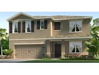 Charming two-story home showcasing a welcoming entrance, a two-car garage, and tasteful exterior finishes at 3516 Rosewood Ramble Ct, Plant City, FL 33565