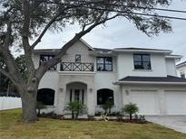 Stunning two-story home with white brick accents, black framed windows and a two-car garage at 3910 W San Carlos St, Tampa, FL 33629