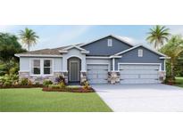 Beautiful single-Gathering home featuring a stone and siding exterior, landscaped yard, and an attached two-car garage at 4028 Harvest Hearth Pl, Plant City, FL 33565