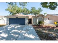 Charming single-story home with a well-manicured front yard and a two-car garage at 3039 Sean Way, Palm Harbor, FL 34684