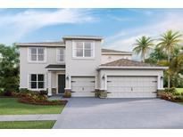 Inviting two-story home with a three-car garage, well-manicured landscaping, and classic design at 4030 Harvest Hearth Pl, Plant City, FL 33565