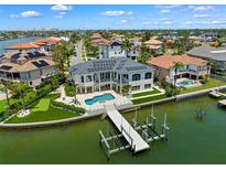 Waterfront home with solar panels, private pool, and dock with boat lifts at 6202 Pasadena Point Blvd, Gulfport, FL 33707
