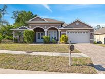 Charming single-Gathering home with a well-manicured lawn and a two-car garage, perfect for suburban living at 9127 Irondale Ln, Hudson, FL 34667