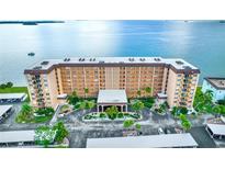 An inviting condo complex with covered parking and lush landscaping offers waterfront views at 9 Haig Pl # 510, Dunedin, FL 34698