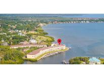 Waterfront condo building with private boat slips and stunning water views at 140 Brent Cir, Oldsmar, FL 34677