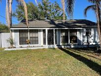 Charming single-story home with a well-maintained lawn and freshly painted exterior at 321 David Ave, Clearwater, FL 33759