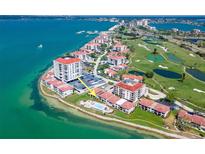 Panoramic aerial view of the waterfront property with golf course access and community pool at 6279 Sun Blvd # 103, St Petersburg, FL 33715