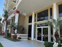 Elegant condo building entrance with a clear view of the front doors and surrounding greenery at 750 4Th S Ave # 403C, St Petersburg, FL 33701