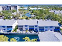 Beautiful aerial view of waterfront condos with manicured grounds and a lovely canal at 11531 Shipwatch Dr # 1030, Largo, FL 33774