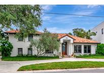Stunning two-story home featuring a beautiful terra cotta roof and manicured front lawn at 2512 S Dundee St, Tampa, FL 33629