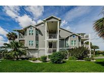 Attractive multi-story condo building featuring well-maintained landscaping and inviting staircases at 5712 Biscayne Ct # 205, New Port Richey, FL 34652