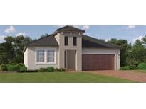Inviting single-Gathering home featuring a two-car garage and well-manicured lawn at 11817 Sparkling Topaz Cv, Parrish, FL 34219
