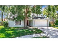 Charming single-story home featuring a spacious front yard and a two-car garage at 1530 High Knoll Dr, Brandon, FL 33511