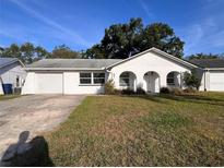 Charming single-story home with a well-maintained lawn and attached one car garage at 3655 Dellefield St, New Port Richey, FL 34655