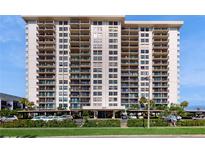 Luxury high-rise condo building featuring multiple stories, balconies, and covered parking at 400 Island Way # 210, Clearwater Beach, FL 33767