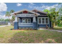 Charming craftsman home featuring a lovely front porch and beautifully landscaped yard at 121 W Mohawk Ave, Tampa, FL 33604