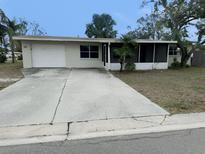 Charming single-story home with a well-maintained lawn and driveway at 3851 72Nd N St, St Petersburg, FL 33709