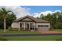 Charming single-story home with a covered front porch, a two-car garage, and landscaped yard at 4470 Southern Valley Loop, Brooksville, FL 34601