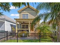 Charming two-story home with a welcoming front porch and well-maintained landscaping at 1816 E 15Th Ave, Tampa, FL 33605