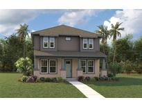 Charming two-story home with a well-manicured lawn and lovely landscaping at 1522 W Arch St, Tampa, FL 33607