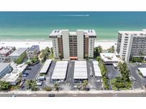 Aerial view of building on beach with beach access, parking, and beautiful ocean views at 15400 Gulf Blvd # 202, Madeira Beach, FL 33708