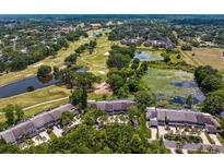 Beautiful aerial view of the property showcasing the golf course, community, and lush greenery surrounding the homes at 4240 Golf Club Ln, Tampa, FL 33618