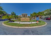 Welcome to Avalon, featuring lush landscaping, palm trees, and a tranquil fountain at 1240 S Missouri Ave # 415, Clearwater, FL 33756