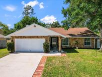 Charming single story home featuring a two-car garage and stone accents at 2720 Wiltshire Ave, Palm Harbor, FL 34685