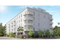 Modern apartment building featuring multiple balconies, neutral colors, and street-level landscaping at 600 3Rd S Ave # 503, St Petersburg, FL 33701