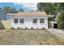 Charming single-story home featuring a brick facade, three windows, and manicured landscaping at 1125 19Th N Ave, St Petersburg, FL 33704
