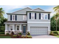 Charming two-story home with a gray exterior, stone accents, and a two-car garage at 2250 Sienna Spruce St, Wesley Chapel, FL 33543