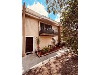 Charming condo features a private balcony with lovely landscaping and dark trim at 5407 Sweetwater Terrace Cir # 5407, Tampa, FL 33634