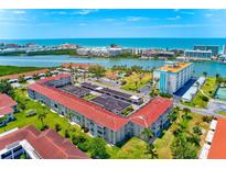 Stunning aerial view of the condos showing the waterfront location and lush landscaping at 10215 Regal Dr # 41, Largo, FL 33774