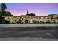 Charming condo complex features covered parking and well-maintained landscaping at 9945 47Th N Ave # 208, St Petersburg, FL 33708