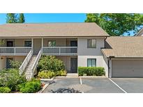 Inviting two-story condo with charming stairs, balcony, and lovely landscaping at 3709 Greenery Ct # 209, Tampa, FL 33618